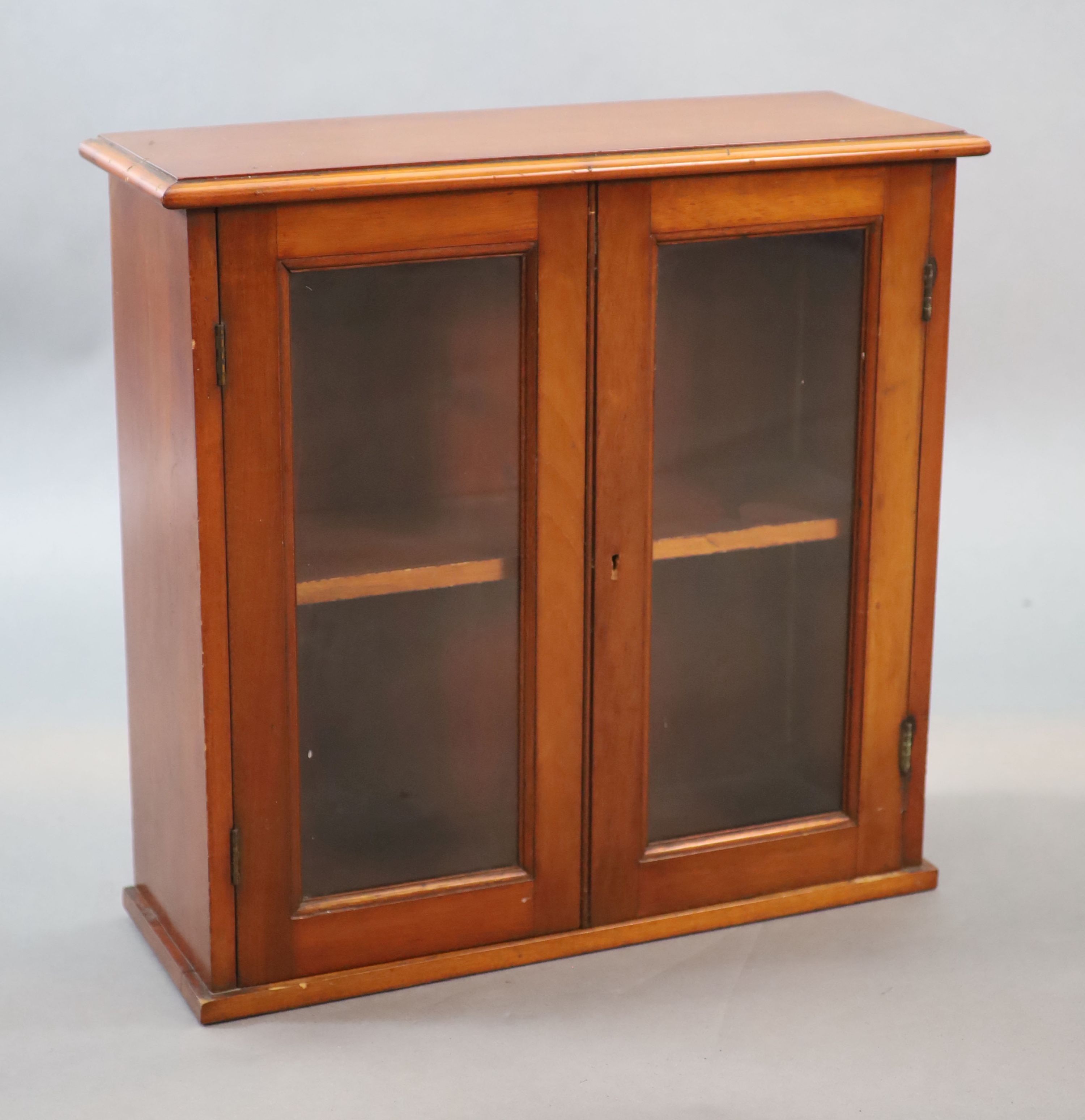 A small Edwardian mahogany wall cabinet, W.58cm D.21cm H.57cm